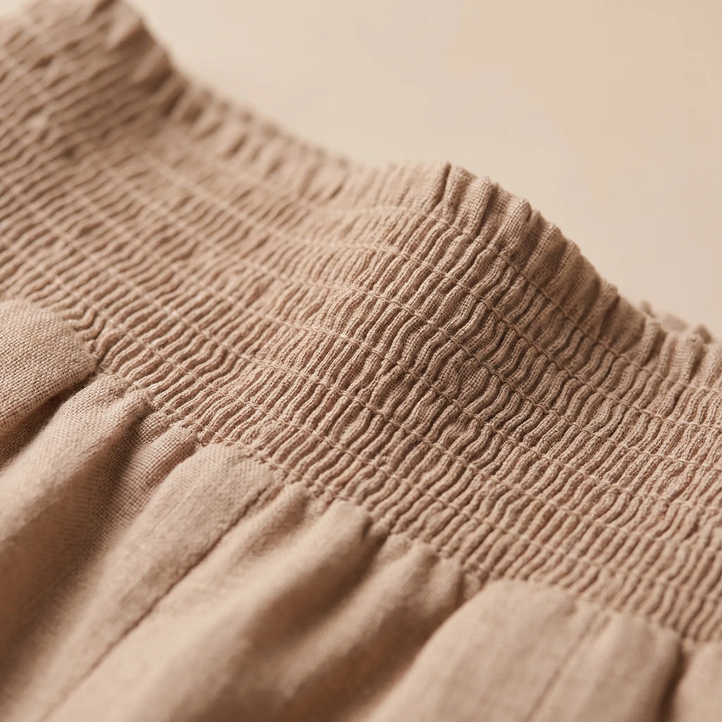 Aeraflow - High-Waisted Smocked Wide-Leg Trousers