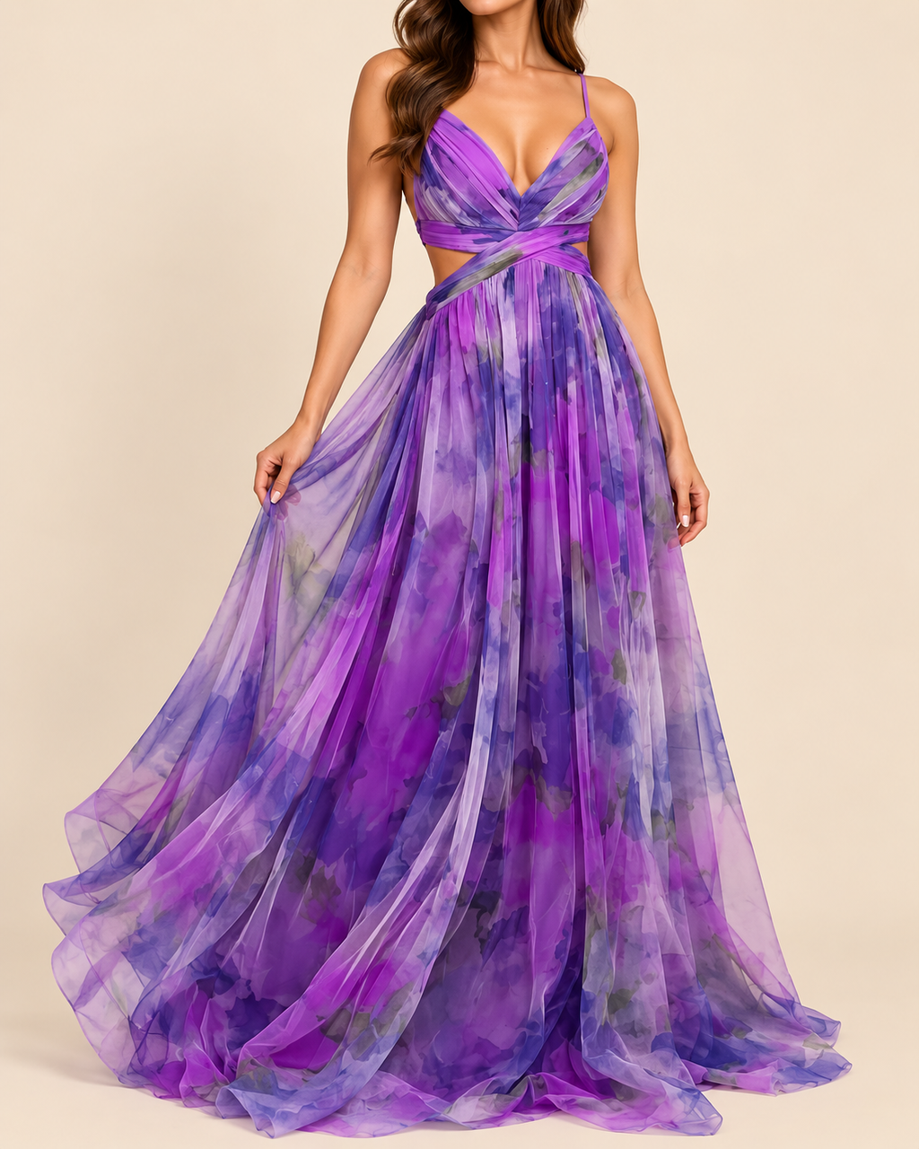 A woman modeling a floor-length purple and violet tie-dye chiffon gown with spaghetti straps, a crossover sweetheart neckline, and a side cutout at the waist, set against a solid beige background.
